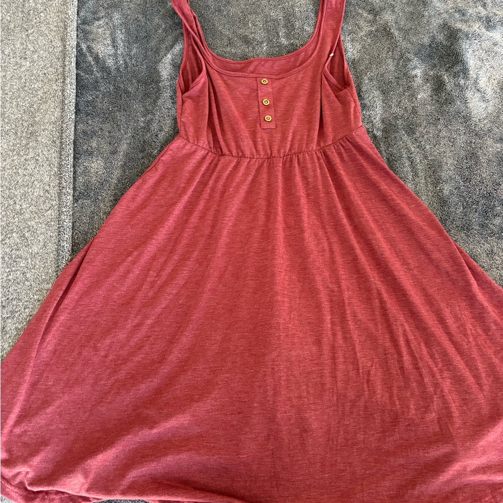 Stylish Red Sleeveless Dress with Button Detail